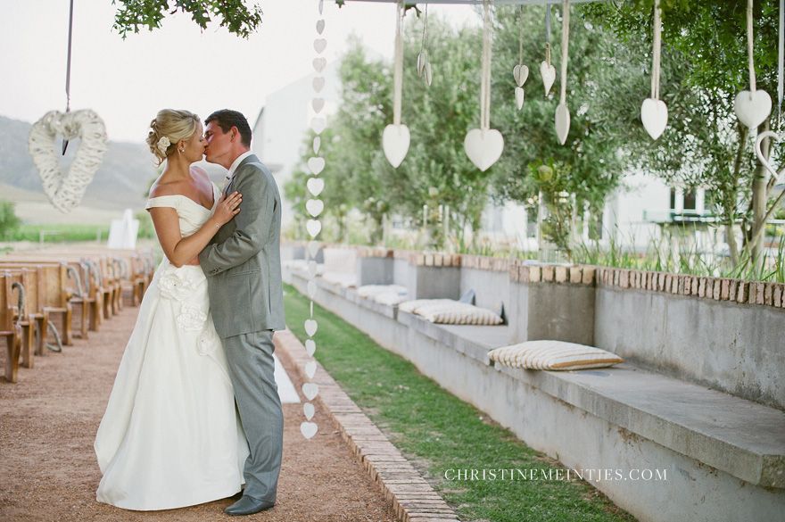 Groom carrying his bride at South Hill Vineyards